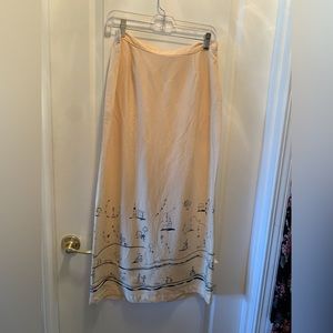 “Clio” size L long pale yellow skirt 35” length, w 15” accross w elastic back